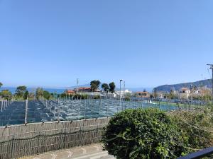 a baseball field with empty seats and a fence at Rota Suites in Sorrento