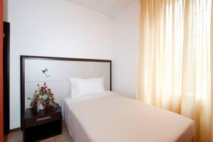 Postel nebo postele na pokoji v ubytování Albergo Maccagno