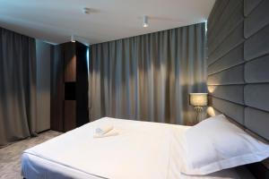 Postel nebo postele na pokoji v ubytování Hotel Turist