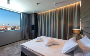 Postel nebo postele na pokoji v ubytování Hotel Turist