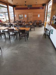 a dining room with wooden tables and chairs at La pacheca in Lazise