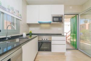 A kitchen or kitchenette at Villa Dolphin by Slow Villas