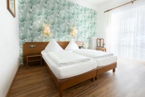 Postelja oz. postelje v sobi nastanitve Hotel Müller