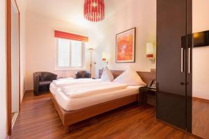Postelja oz. postelje v sobi nastanitve Hotel Müller