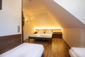 Postelja oz. postelje v sobi nastanitve Hotel Müller