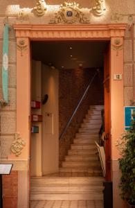
a stairway leading to a room with stairs at Alcazaba Premium Hotel in Málaga
