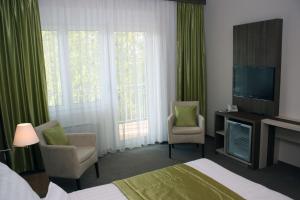Postel nebo postele na pokoji v ubytování Hotel Európa Gunaras
