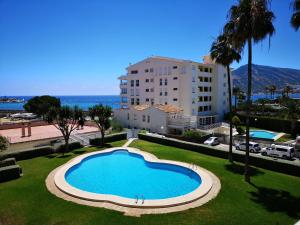 Bazén v ubytování Acogedor apartamento frente al mar con piscina nebo v jeho okolí