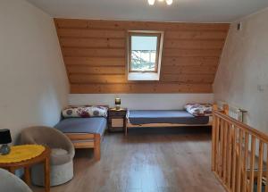 Posteľ alebo postele v izbe v ubytovaní Apartamenty U Samków