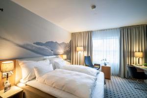 Giường trong phòng chung tại Grand Hotel - by Classic Norway Hotels