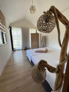 Säng eller sängar i ett rum på Marimare Beach & Bungalow