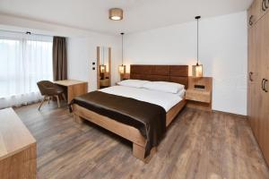 Posteľ alebo postele v izbe v ubytovaní APLEND Hotel Ovruč