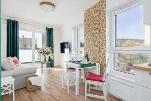 Televízia a/alebo spoločenská miestnosť v ubytovaní Rezydencja Rejtana with FREE GARAGE Poznań by Noclegi Renters