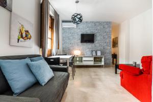Televízia a/alebo spoločenská miestnosť v ubytovaní tuGuest Isabel la Catolica II Apartment
