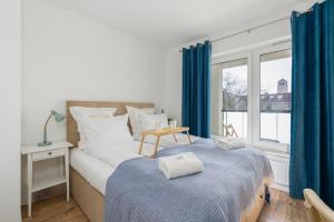 Posteľ alebo postele v izbe v ubytovaní Rezydencja Rejtana with FREE GARAGE Poznań by Noclegi Renters