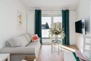 Televízia a/alebo spoločenská miestnosť v ubytovaní Rezydencja Rejtana with FREE GARAGE Poznań by Noclegi Renters