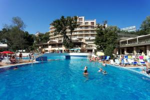a group of people swimming in a swimming pool at Kristal Hotel - All inclusive in Golden Sands