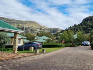 a street in a village with a stop sign at Clarens Villas in Clarens