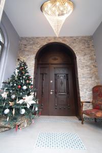 a christmas tree in front of a door at Luxury Room Bahai's Garden in Haifa