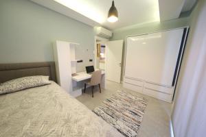Postel nebo postele na pokoji v ubytování Sky Garden Suites