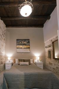Säng eller sängar i ett rum på Casa del Maestro