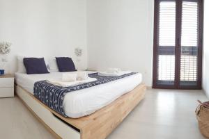 Posteľ alebo postele v izbe v ubytovaní RgB_Apartments
