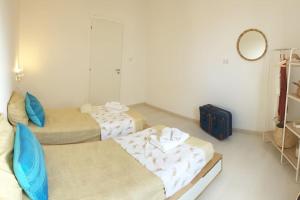 Posteľ alebo postele v izbe v ubytovaní RgB_Apartments