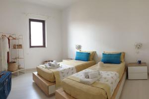 Posteľ alebo postele v izbe v ubytovaní RgB_Apartments