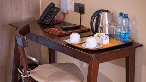 Kaffee-/Teezubehör in der Unterkunft The Kyaka Hotel