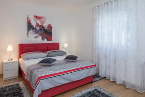 Katil atau katil-katil dalam bilik di Villa Giardino