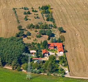 an aerial view of a house in a field at Ferienhaus "Hauß" Objekt ID 12063-3 in Waren