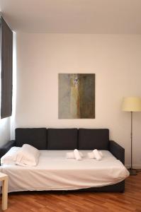 Posteľ alebo postele v izbe v ubytovaní Claris Apartments