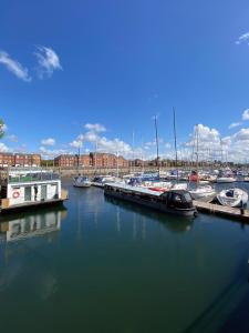 a group of boats docked in a marina at Djinn Palace by Serviced Living Liverpool in Liverpool