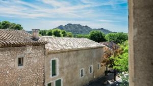 an aerial view of a building with mountains in the background at La Terrasse d'Eygalières in Eygalières