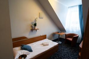 Łóżko lub łóżka w pokoju w obiekcie Hotel SANVIT RESTAURACJA & SPA