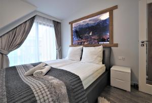 Posteľ alebo postele v izbe v ubytovaní VIP Apartamenty Modrzejewska Residence