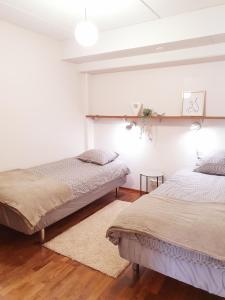 Postel nebo postele na pokoji v ubytování Ellivuori Resort Hehku
