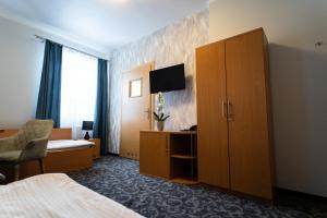 Telewizja i/lub zestaw kina domowego w obiekcie Hotel SANVIT RESTAURACJA & SPA