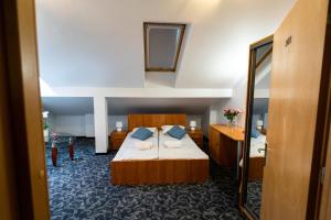 Łóżko lub łóżka w pokoju w obiekcie Hotel SANVIT RESTAURACJA & SPA