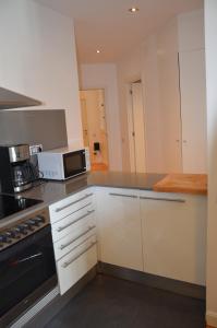 Kuchyňa alebo kuchynka v ubytovaní Claris Apartments