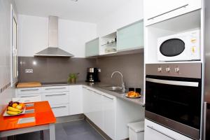 Kuchyňa alebo kuchynka v ubytovaní Claris Apartments