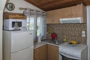 A kitchen or kitchenette at Corfu Cosy Penthouse with a View