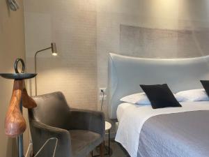 Postel nebo postele na pokoji v ubytování Residenze Romano Ristorante & SPA albergo diffuso - WHITE + 37 fotografií