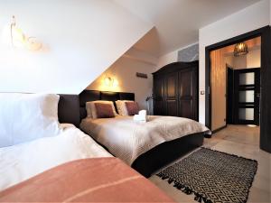 Posteľ alebo postele v izbe v ubytovaní VIP Apartamenty Modrzejewska Residence