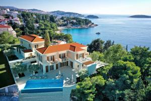 an aerial view of a villa on the water at Luxury Villa Hvar Deluxe Palace 1 with heated pool, gym and sauna in Hvar