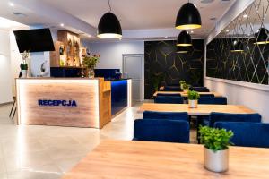 Telewizja i/lub zestaw kina domowego w obiekcie Hotel SANVIT RESTAURACJA & SPA