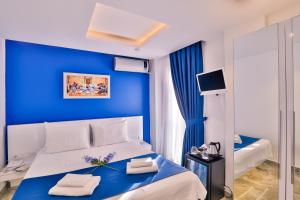 Un pat sau paturi într-o cameră la Bellezza Hotel Ortakoy
