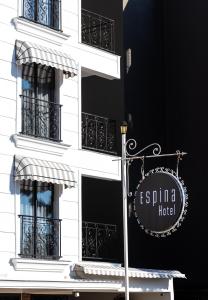 a sign on the side of a building with windows at Espina Hotel in Antalya