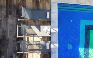 an overhead view of a swimming pool with chairs next to it at Espina Hotel in Antalya