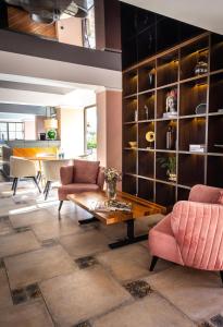 a living room with two chairs and a table at Espina Hotel in Antalya